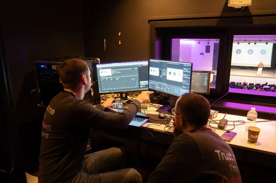 Employees working on computers during a keynote